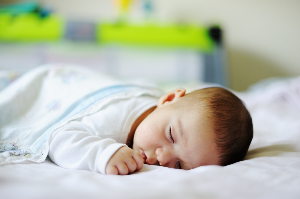 Teaching Babies to Roll from Belly to Back: Sleep Solutions During Motor Milestones